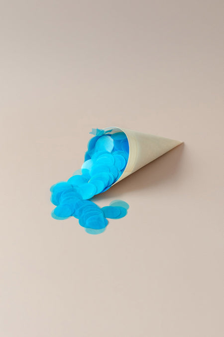 A cone filled with vibrant blue confetti, ideal for wedding festivities and celebrations.